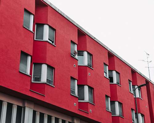 window red concrete multi-storey building curtain